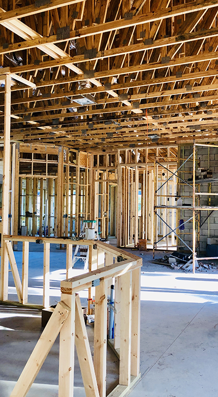 Home remodeling contractor reviewing construction estimate for residential renovation project.